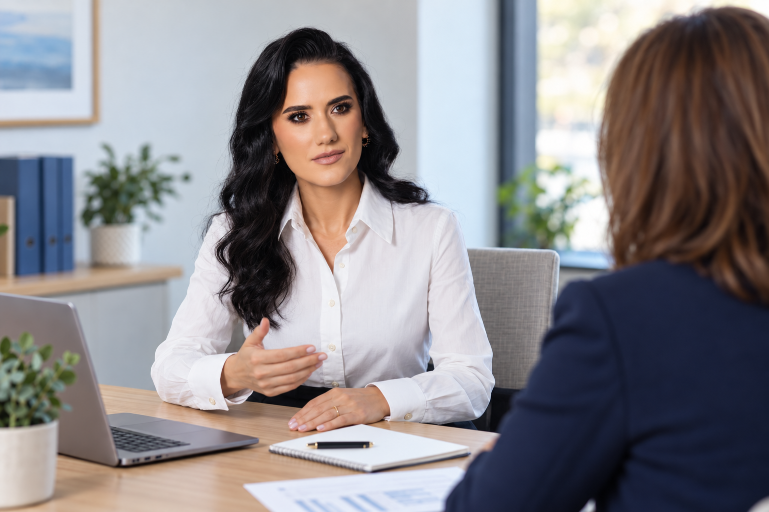 Illustrative image of Svitlana Zubchyk discussing work with another professional